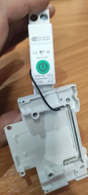 Smart Wi-Fi relay module with measurement and VA protection Disassembled smart Wi-Fi relay with “VA protection” label visible on casing