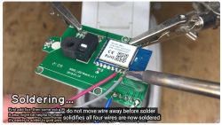 Soldering wires to an electronic module.