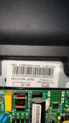 HKC CORPORATION LIMITED label on casing with a close-up of a green circuit board below
