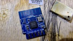 CB2S Electronic Module with BK7231M Close-up of a CB2S electronic module labeled BK7231M on a wooden surface.