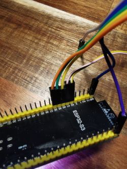 ESP32-S3 board with connected colored wires.