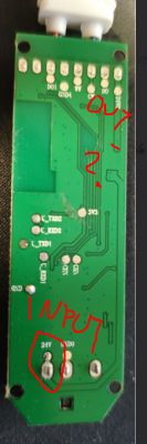 View of a circuit board with marked INPUT 24V locations and labels OUT and a question mark on other pins.