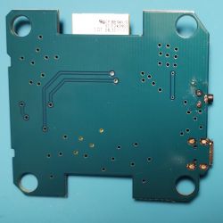 Bottom of a printed circuit board marked NH-BLE-WIFI-GW with visible traces and mounting holes.