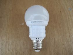 White ZemiSmart bulb on a wooden background.