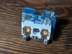 Close-up of a PCB with integrated Zigbee chip and 5V relay socket