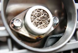 Close-up of a Mechanical Component with Screws Close-up of a metal component with two screws.