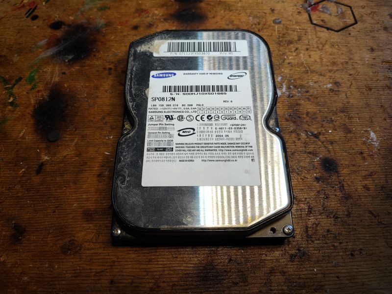 Samsung SP0812N Hard Drive Samsung SP0812N hard drive on a wooden table