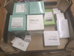 Boxes of electronic components in a cardboard box.
