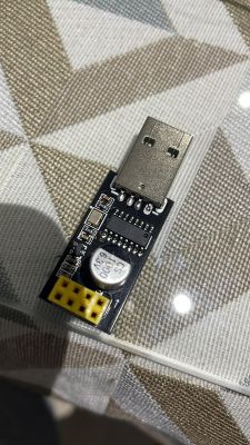 Electronic Board with USB Port Image of an electronic board with a USB port placed on a table surface.