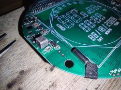 Circuit board with electronic components and a display.
