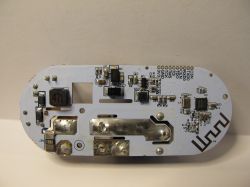 Interior of MOES US Matter Smart Plug Electronic components of MOES US Matter smart plug on a white PCB.