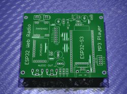 Green ESP32 PCB with labels for LCD, ESP32-S3, amplifier, and audio output modules