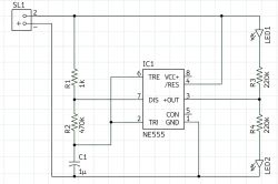 Circuit diagram with NE555 timer, resistors, capacitor, and two LED diodes