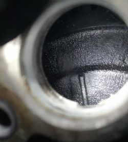 Image of the engine mechanism interior with a clear marker.