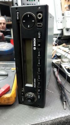 Bosch Calais USB40 car radio on a workshop table.