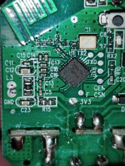 Close-up of a circuit board with an integrated chip and electronic components.