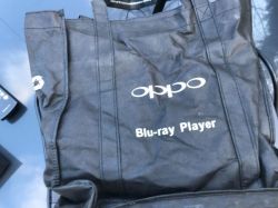 Black tote bag printed with “oppo” and “Blu-ray Player” on a glossy surface