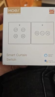 MOES Smart Curtain Switch Packaging Box of MOES smart curtain switch with Alexa and Google Assistant logos.