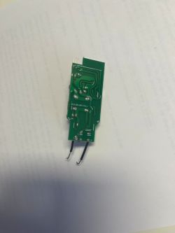 Green printed circuit board with electrical circuits.
