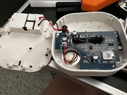 Inside an Optical Smoke Detector Opened optical smoke detector with visible internal electronic components.