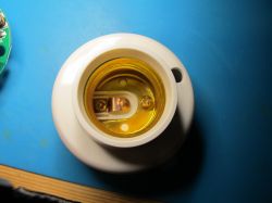 Close-up of an E27 lamp socket showing metal contact elements.
