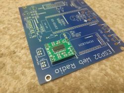 Green electronic module on a blue PCB labeled “ESP32 Web Radio”