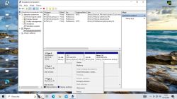 Zrzut ekranu z zarządzania dyskami systemu Windows, pokazujący dysk z kilkoma partycjami, w tym partycję systemową C i inne partycje.