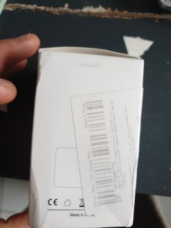 White packaging with barcode stickers and Made in China text.