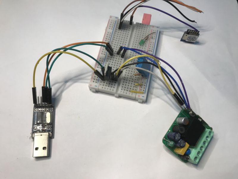 Sonoff Mini R4M module connected to USB-UART adapter and breadboard