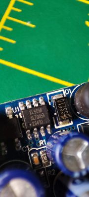 Close-up of electronic components on a circuit board, including an XLSEMI XL7005A chip and an SS210 diode.