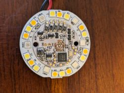 LED Bulb Circuit Board Photo of a round LED bulb circuit board with visible electronic components and diodes.