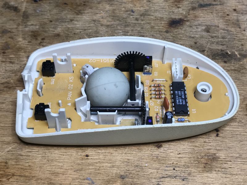 Interior of a Ball Computer Mouse Interior of an older ball mouse with electronic components.