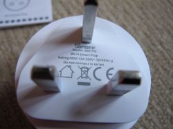 Technical label on Sonoff S60TPG iPlug UK smart plug Close-up of the label on the Sonoff S60TPG smart plug with three UK metal prongs visible.