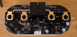 Interior of a dual smart plug with exposed electronic components.