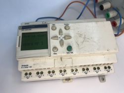 The interior of an old Schneider Electric SR1 A201BD programmable logic controller