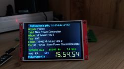 Small LCD screen displaying details of an MP3 file played from an SD card