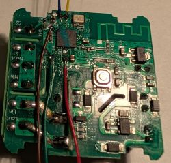 PCB with wires and electronic components Close-up of a circuit board with soldered wires and electronic components