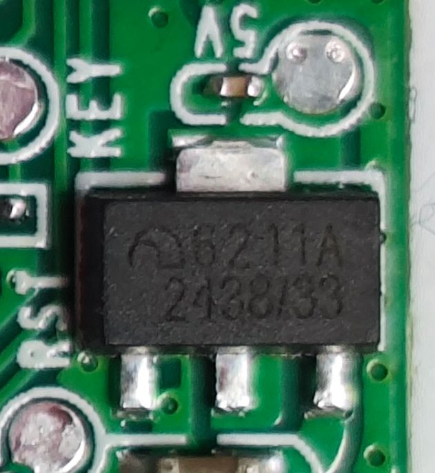 ME6211A33PG-N LDO Voltage Regulator on PCB Close-up of ME6211A33PG-N 6211A voltage regulator IC on a green PCB, with visible 5V, KEY, and RST labels.