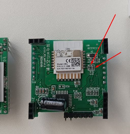 Green PCB with a CBU module, connectors, and red arrows pointing to components