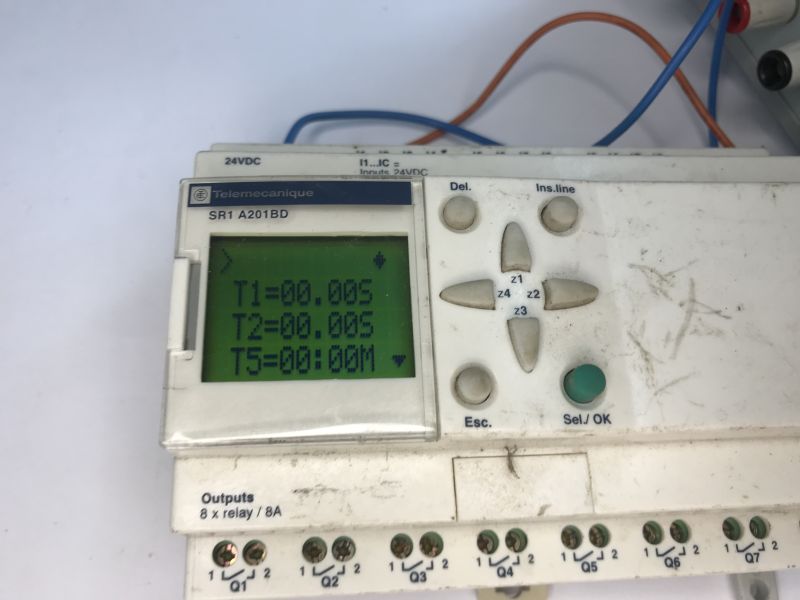 Telemecanique Zelio Logic SR1 A201BD controller with green LCD screen and keypad on the front panel