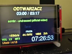 Small player screen showing “ODTWARZACZ”, 03:00/03:17, and a large clock reading 07:26:53