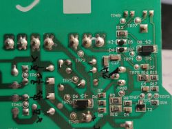 Circuit board with labels and electronic components.