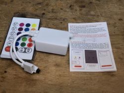 LED Controller with Remote and Manual LED strip controller with remote and manual on wooden background