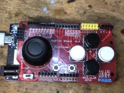Joystick Shield on Arduino Board Joystick shield on an Arduino board with buttons and control elements