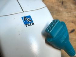 A4Tech computer mouse next to a blue connector.