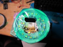 Round LED panel with a green protective filter.