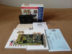 Sound Galaxy set: product box, ISA sound card, two speakers, and manuals on a beige background