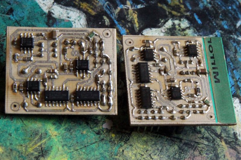 Two PCBs with integrated circuits and visible soldered traces.