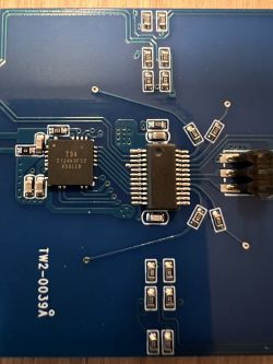 PCB with mounted electronic components, including a T34 microcontroller.