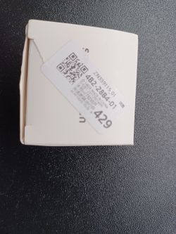 Box with Smart Switch Box with a sticker containing a QR code and serial numbers.